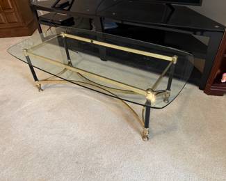 	#33	Glass top coffee table 51x26x16	 $40.00 				