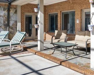 Patio loungers, swivel chairs, love seat, and table