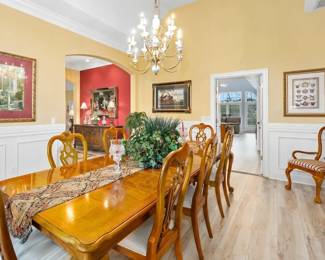 Thomasville dining table with seating for 10, chandelier and all accessories & decor