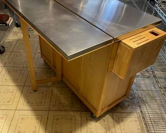 This is a PRE-SALE item - Rolling kitchen inland with expandable leaf - stainless steel top and storage - H 36" D 20 1/2" W 53" fully open.  Great functional piece!  Sold AS IS  - priced at $275 plus 7% sales tax.