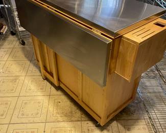 This is a PRE-SALE item - Rolling kitchen inland with expandable leaf - stainless steel top and storage - H 36" D 20 1/2" W 53" fully open.  Great functional piece!  Sold AS IS  - priced at $275 plus 7% sales tax.