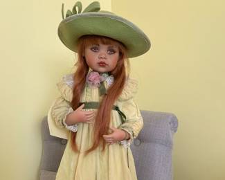 2001 “Lucy” by Jan McClean NZ.  Redhead w stand.  Original clothes, hat and shoes. #410 of 3,500.