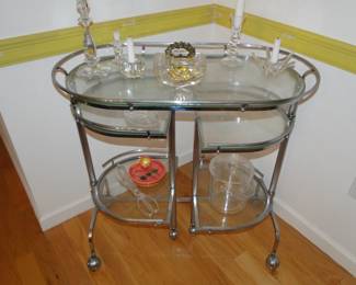 Chrome and Glass tea cart and the crystal and lucite items on it.