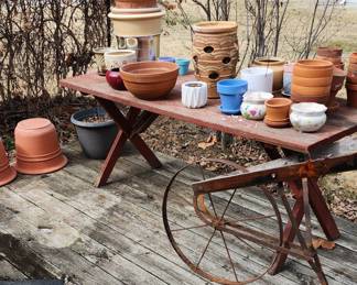 Flower pots and vintage tiller