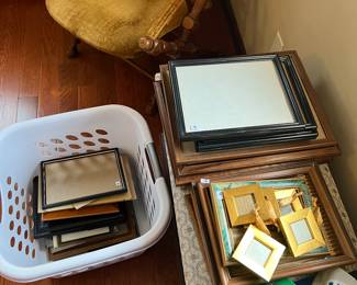 Over 50 wooden / brass / gold tone frames 