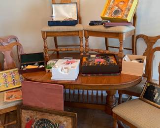 Oak table with 2 leaves and 6 chairs.  Notice the spindles on the bottom!