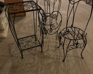 Various iron and wooden plant stands 