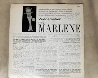 On the back is a signature that might say "Hast mein liebe Marlene Dietrich".
