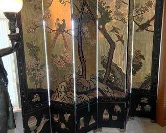 There is also a multi-paneled room divider or if you want to call it a privacy screen, that works, too.