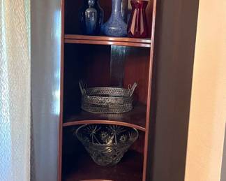 Every once in a while a corner shelving unit comes along, and this is one of those times.  The more unusual part of this is the curved front.