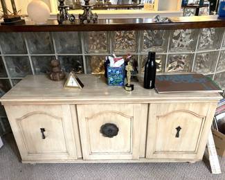 This piece of furniture appears to be intentionally distressed in white.  By the way, the Oscar statue is a "Hollywood Best Uncle".