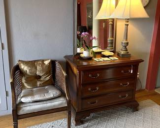 Here you can see another chair with a couple of pillows sitting next to the small dresser and mirror.  Oh, and the lamp and wall clock should not be overlooked.