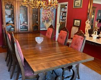 In this photo, the dining table and six matching chairs are shown.  There is room for two more chairs, one at either end, if you're so inclined.