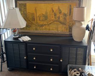 In case you wanted a larger dresser, here is one that might suit your needs.  A pair of lamps are shown here, and don't miss the framed art of Venice.