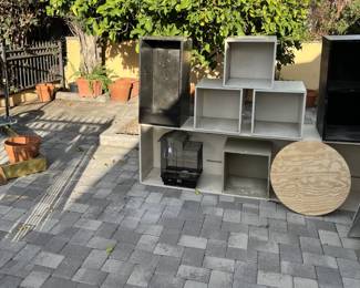 There is a birdcage (more or less in the center of the picture), and several other shelf-like boxes.