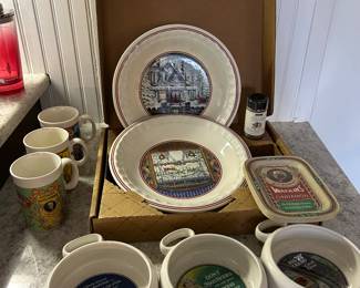 collection of vintage Watkins brand kitchenware, including pie plates, bowls, and cinnamon