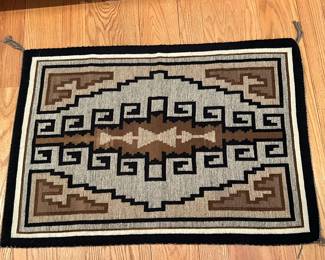 Warm earth tones in this Navajo Wool Rug