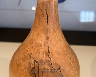 Another great art piece....wooden vase around glass
