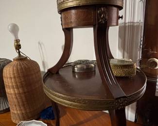 Two tiered banded table, the top tier is marble, a great addition to any room.