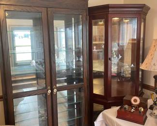 Several Lighted Curio Cabinets