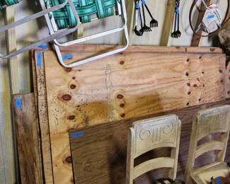 Plywood sheets and lawn chairs