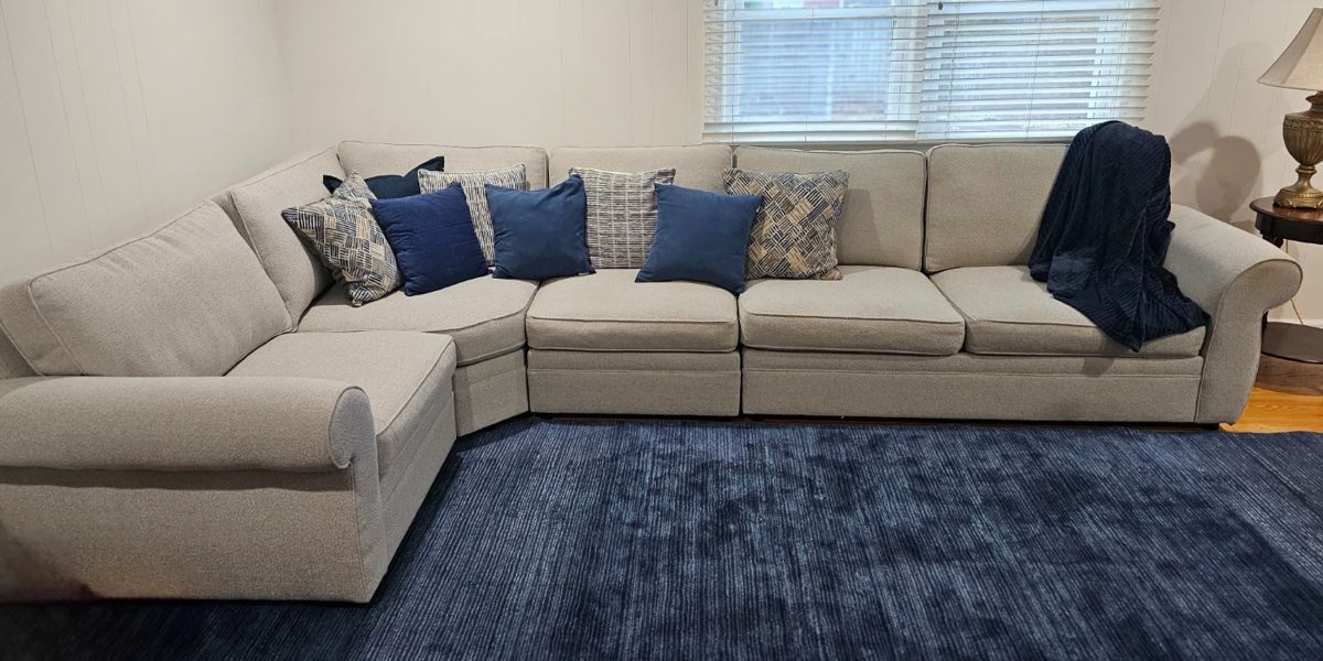 Sectional Sofa with Dark Blue area Rug
