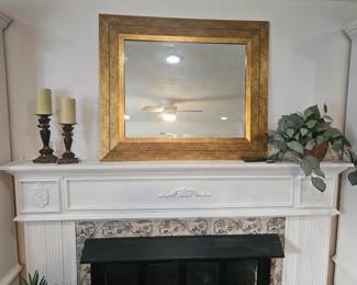 Gold framed mirror and candlesticks