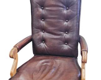 Leather tufted office chair oon rollers with nailhead trim