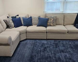 Sectional Sofa with Dark Blue area Rug