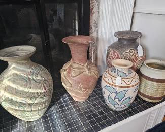 Numerous ceramic vases of various sizes