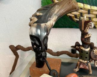 carved horn figure