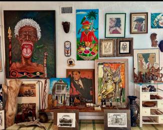 Eclectic mix of original oils paintings 1960's-70's. Large painting on the left is by Felipe Salvador, Afro-Brazilian artist from Angola. The title of this piece isFamine in Saba.