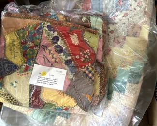 Old handstitched around-the-world quilt and 1950s crazy quilt signed and dated by quilting group
