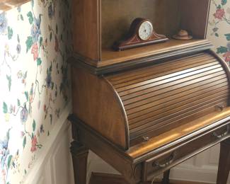 Antique secretary with rolling desk top