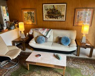 Italian MCM leather couch, vintage travertine coffee table, vintage end tables, fabulous table lamps, leather swivel chair, vintage Persian rug, MCM oil painting (center) & framed prints (flanking) vintage phone, round blue tufted pillows VINTAGE - ALL AVAILABLE TO TAKE HOME THIS SATURDAY!