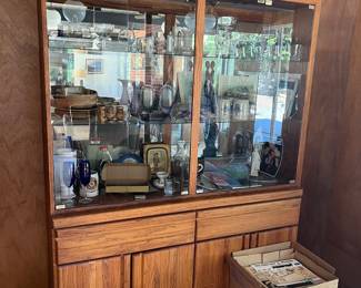 Beautiful oak display cabinet with storage drawers and under cabinets. Brilliant lighting inside above with glass shelving... Available to take home starting Saturday!
