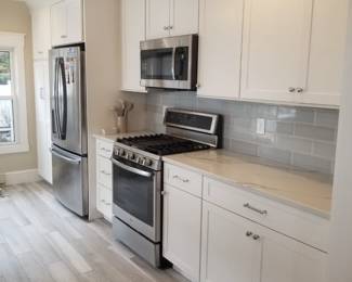 Clean & contemporary kitchen with cabinetry by Diamond; note cabinets are 42" uppers