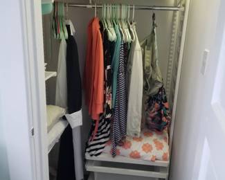 Bedding; clothing. Closet storage system by Elfa