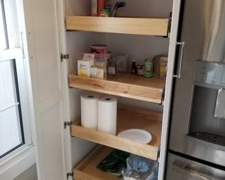 Cabinetry by Diamond includes pantry with pull-out shelves