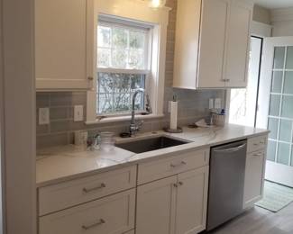Clean & contemporary kitchen with cabinetry by Diamond; note cabinets are 42" uppers