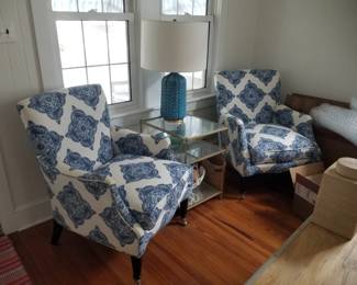 Matching arm chairs feature John Robshaw upholstery