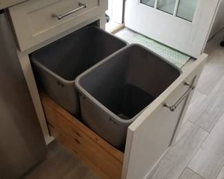 Cabinetry by Diamond includes trash corral