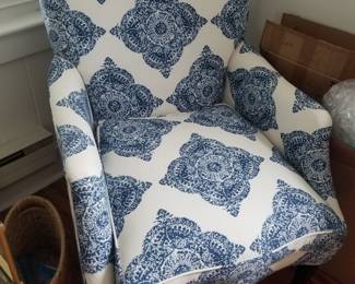 Matching arm chairs feature John Robshaw upholstery