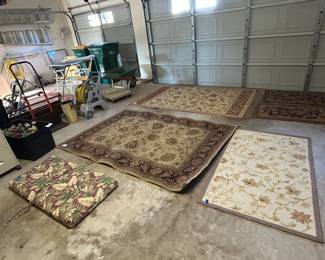 Area rugs, wheelbarrow, dolly, artificial greenery