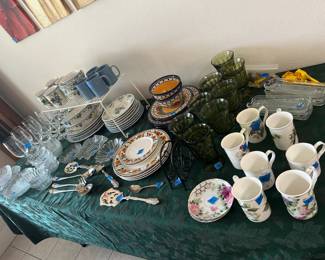 Various dish sets, stemware, and mugs
