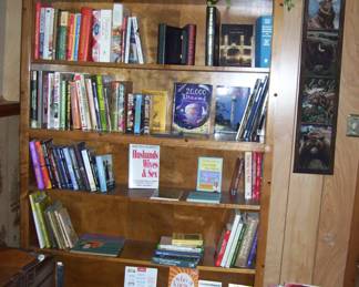 Tall wood bookcase - books