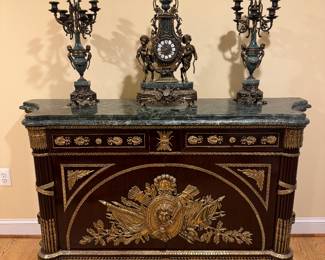 Louis XVI Style Gilt Bronze Mounted Marble Top Commode (21"D x 66"W x 39"H) & Imperial Style Franz Hormel Brevettato Figural Mantle Clock & Brevettato Bronze and Marble 7 Arm Candelabras (2 Total)
