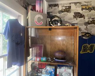 Two beautiful Maple showcases with glass doors sports collectibles inside