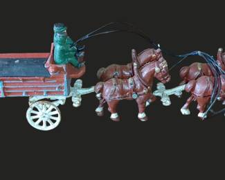 Vintage cast iron wagon with four Clydesdale horses