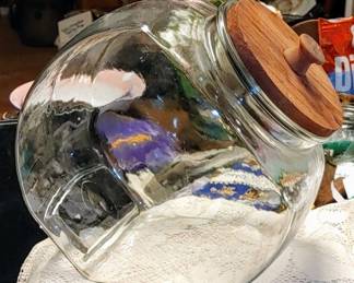 Vintage tilted old store jar with wooden top